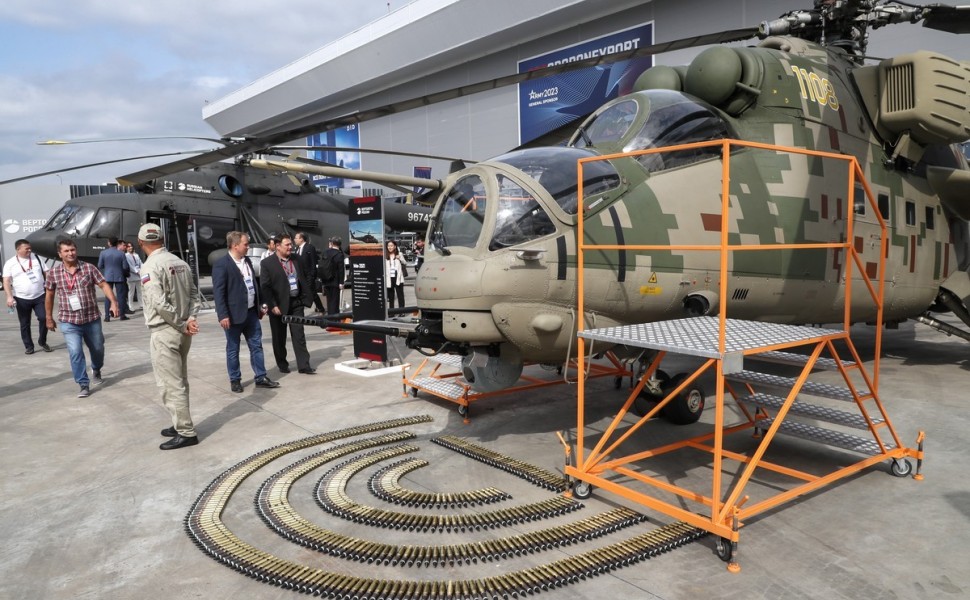 epa10800096 Visitors and specialists walks past Russian helicopter MI-35 P during the International Military-Technical Forum 'Army-2023' held at the Patriot Park in Kubinka, outside Moscow, Russia, 14 August 2023. The International Military-Technical Foru