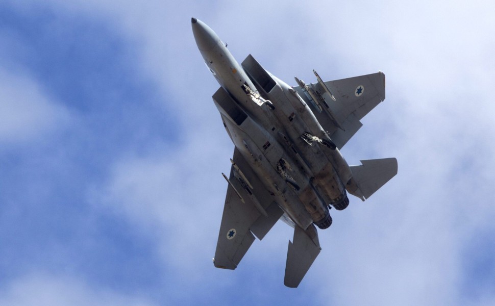 epa03457460 An Israeli F-15 jet fighter as it lowers its landing gear to come in for a landing at an air force base in southern Israel, 04 November 2012 during a routine flight.  EPA/JIM HOLLANDER