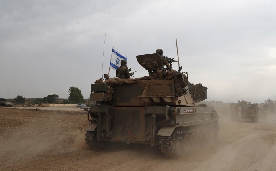 epa10909875 Israeli soldiers on military vehicles maneuver at an area along the border with Gaza, southern Israel, 09 October 2023. Israeli chief military spokesperson Rear-Admiral Daniel Hagari said on 09 October that the country had drafted a record of epa10909875 Israeli soldiers on military vehicles maneuver at an area along the border with Gaza, southern Israel, 09 October 2023. Israeli chief military spokesperson Rear-Admiral Daniel Hagari said on 09 October that the country had drafted a record of