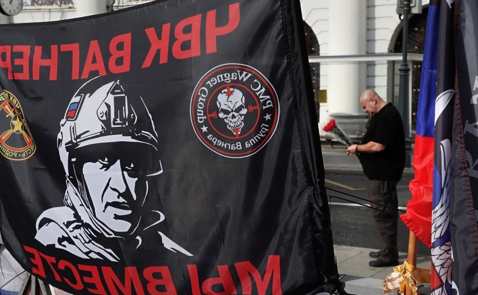 epa10894048 The portrait of PMC Wagner Group's late chief Yevgeny Prigozhin printed on a flag at an informal memorial on the 40th day since his death, near the Kremlin in Moscow, Russia, 01 October 2023. Russian authorities on 27 August 2023 confirmed tha