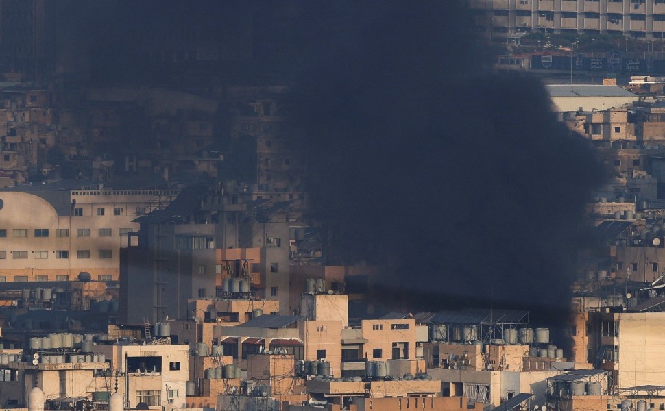 Smoke billows over Beirut's southern suburbs after an Israeli strike, Mohamed Azakir/Reuters