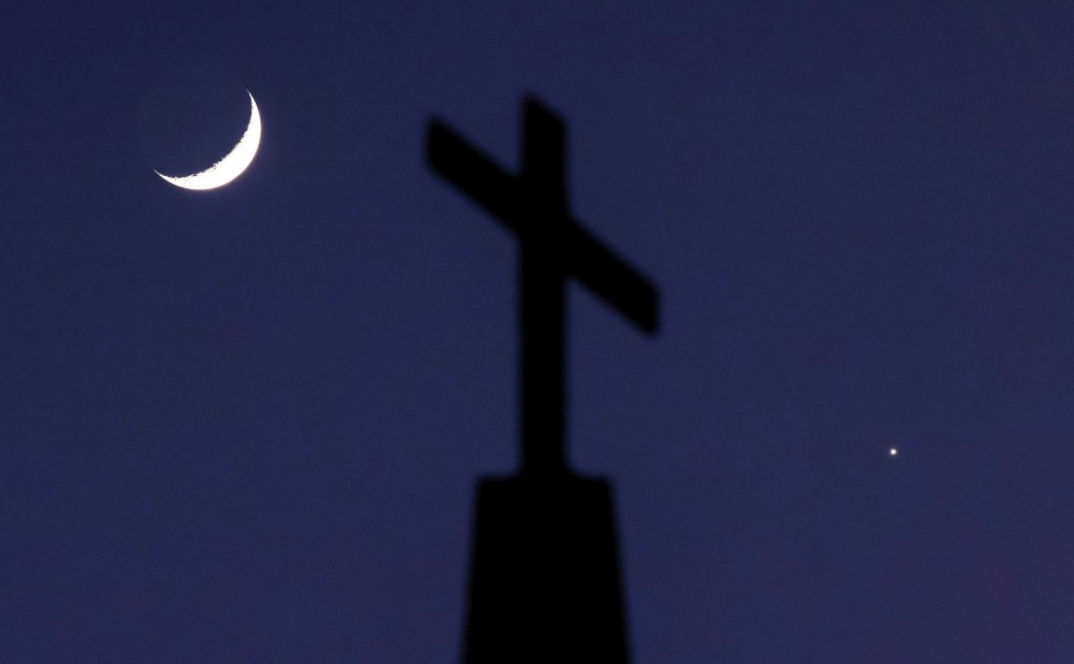 A crescent moon and the planet Venus are seen in Ellaville, Georgia - Reuters