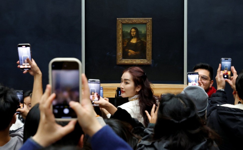 Tourists at the Louvre Museum in Paris - Reuters